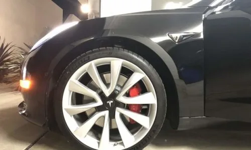 Model 3 Performance wheel and red brake caliper